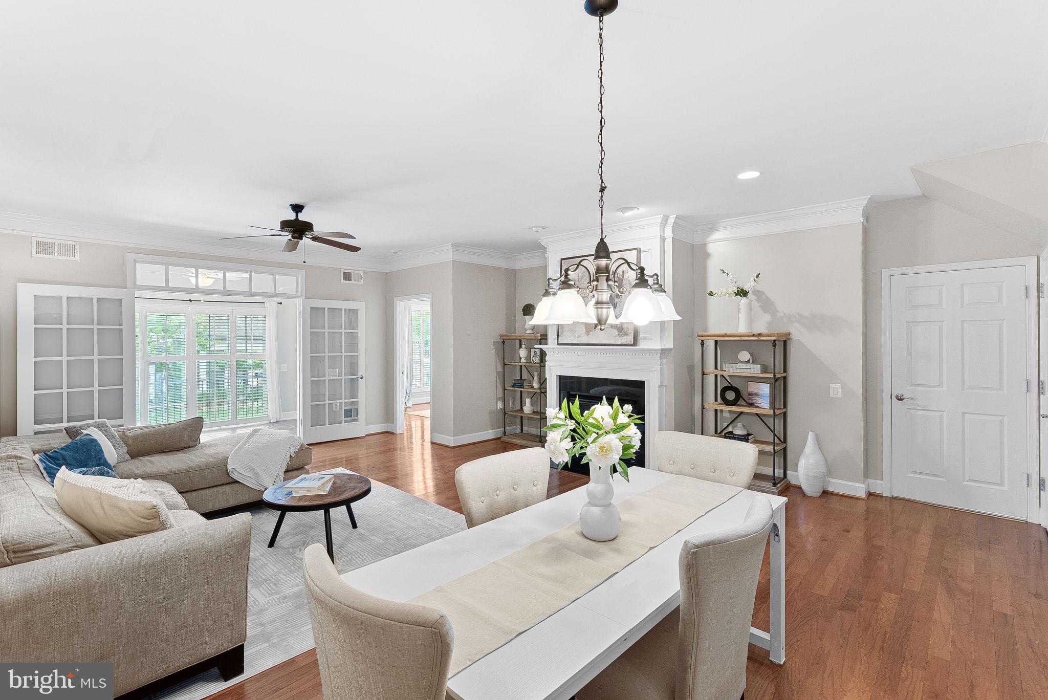 44424 Sunset Maple Drive Ashburn, VA 20147 - Photo 17 of 63 a living room with furniture and a chandelier