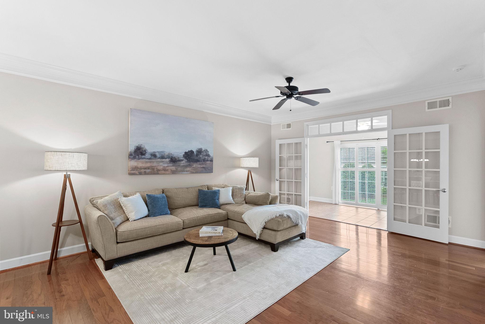 44424 Sunset Maple Drive Ashburn, VA 20147 - Photo 19 of 63 a living room with furniture and a large window