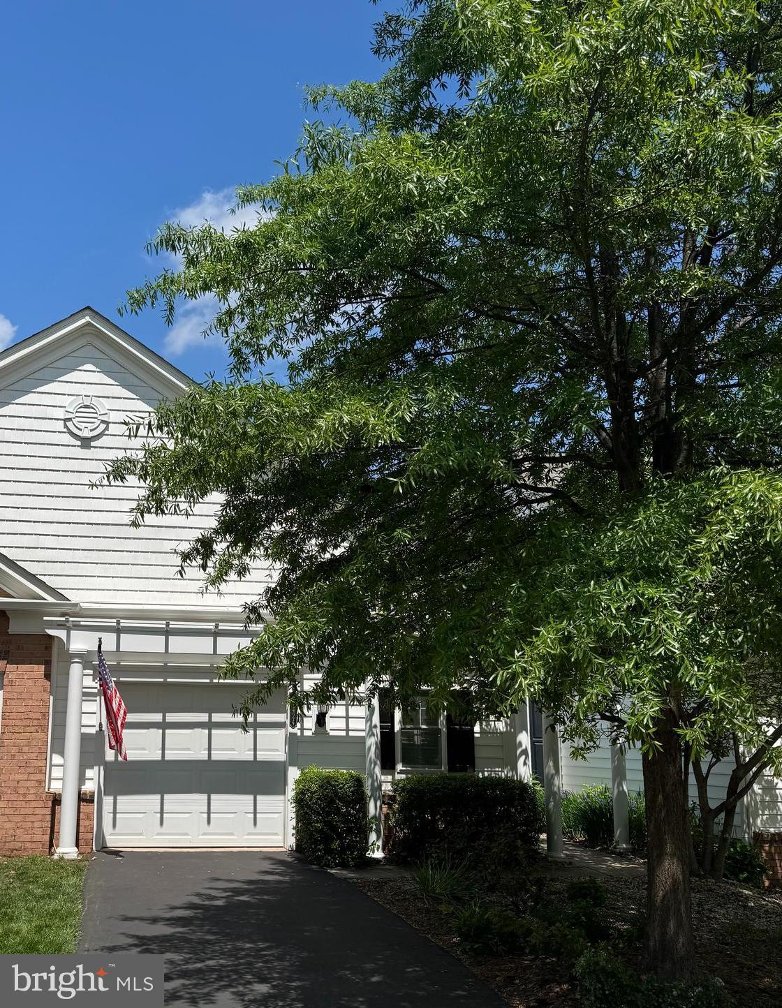 44424 Sunset Maple Drive Ashburn, VA 20147 - Photo 3 of 63 a front view of a house with a yard