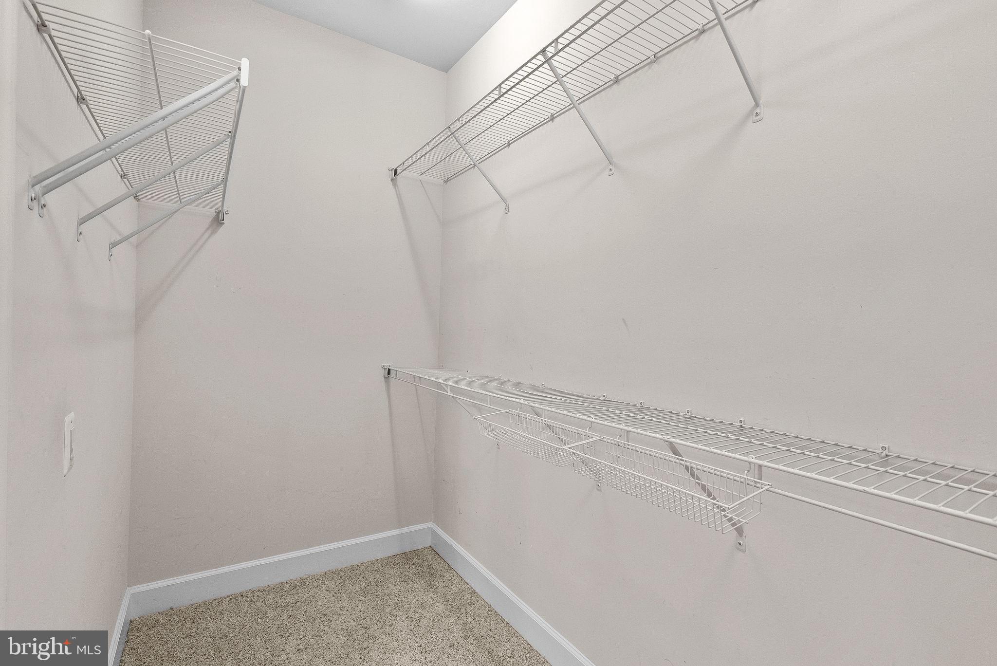 44424 Sunset Maple Drive Ashburn, VA 20147 - Photo 32 of 63 a view of a room with racks on the wall