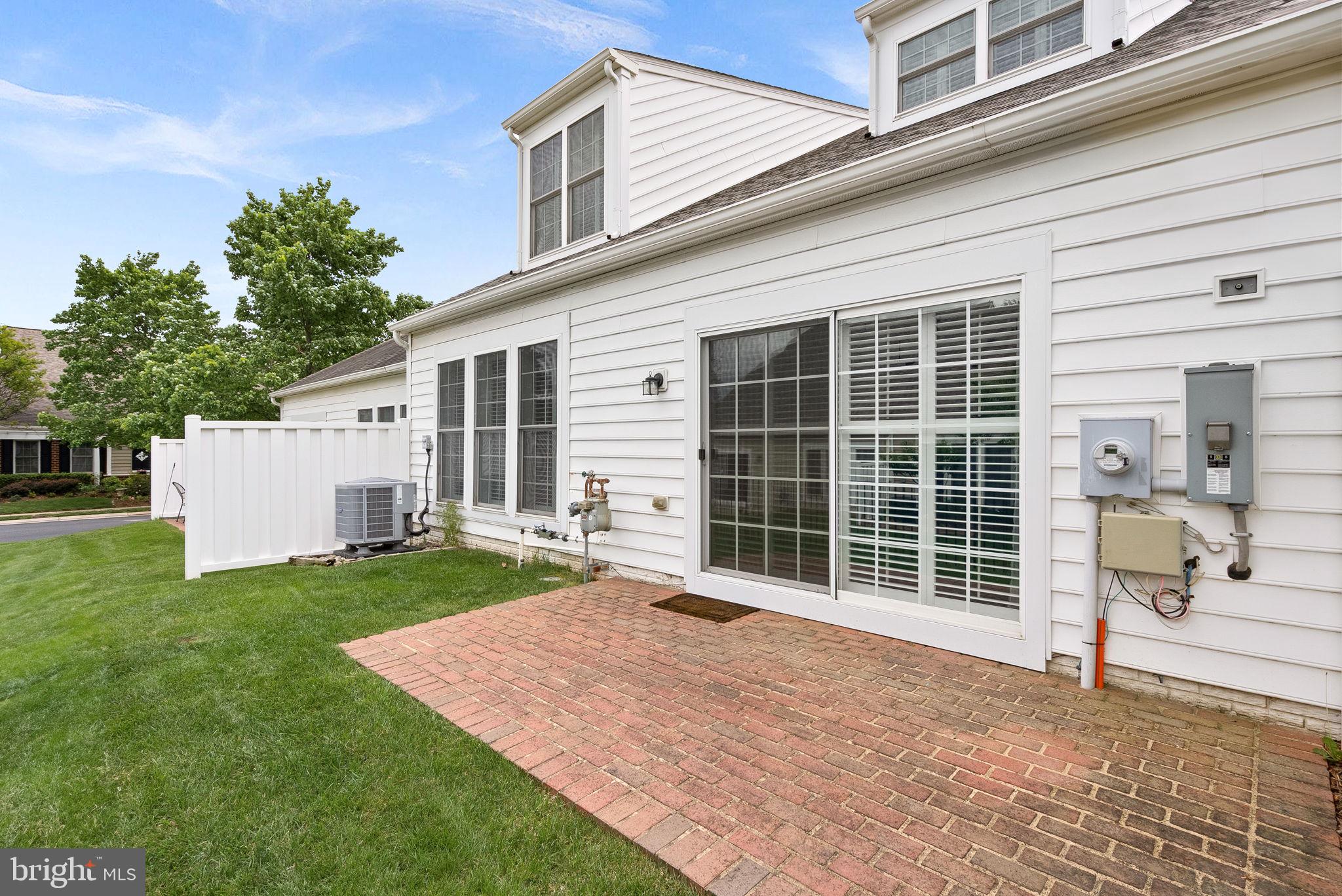 44424 Sunset Maple Drive Ashburn, VA 20147 - Photo 47 of 63 a front view of a house with a garden and yard