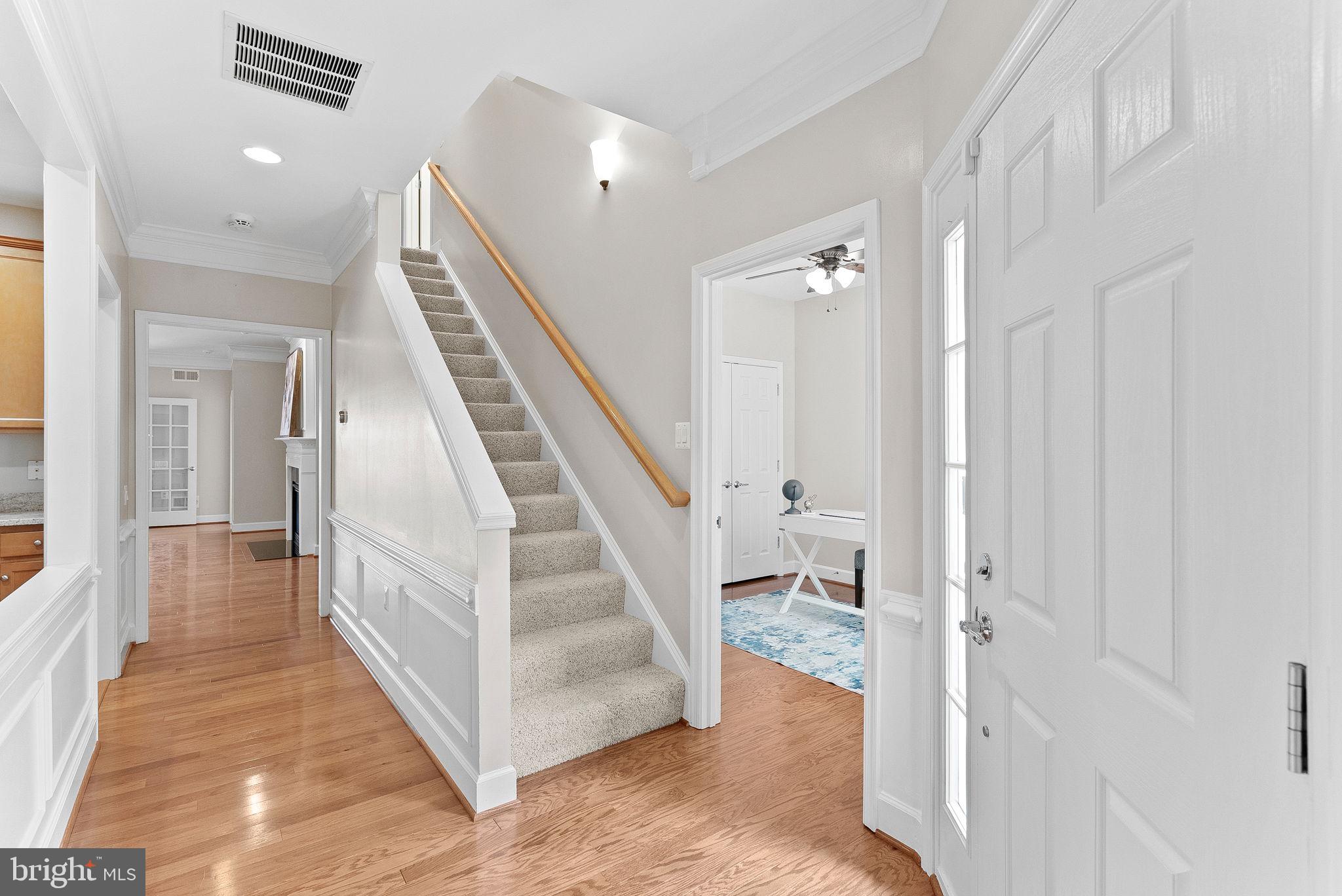 44424 Sunset Maple Drive Ashburn, VA 20147 - Photo 6 of 63 a view of a hallway with staircase and floor to ceiling window
