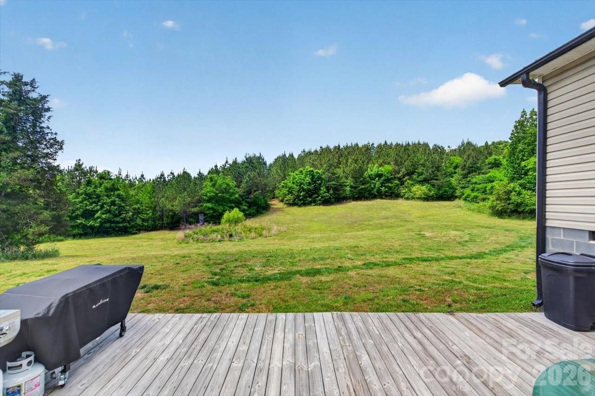 567 Godbey Road Mocksville, NC 27028 - Photo 21 of 38 a view of a balcony with wooden floor and a yard