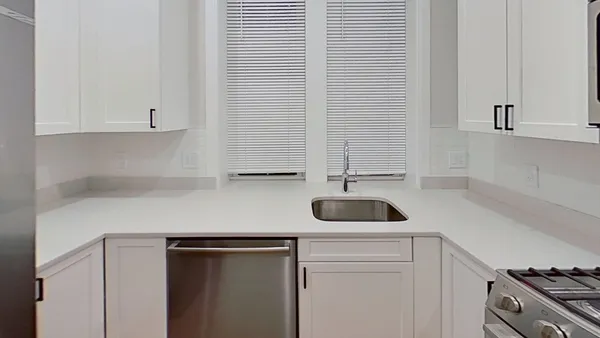 a kitchen with a sink and a stove