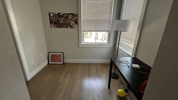 a view of an entryway with wooden floor