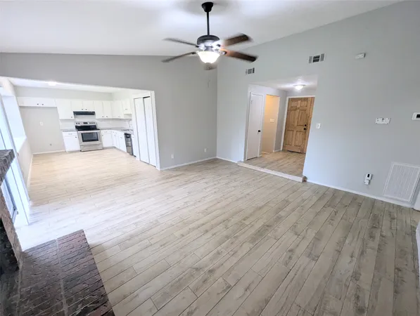 a view of livingroom with hardwood floor and ceiling fan