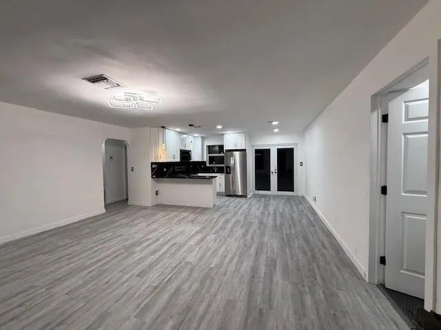 a view of kitchen livingroom with wooden floor