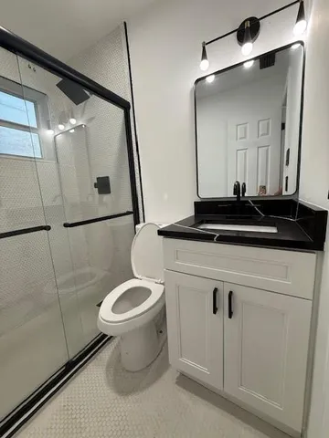 a close view of a toilet sink and a mirror