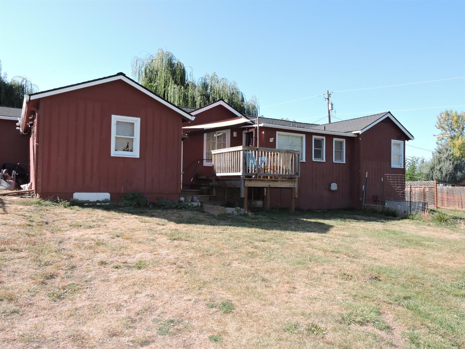 7233 Wagner Creek Road Talent, OR 97540 - Photo 2 of 27 a front view of a house with a yard
