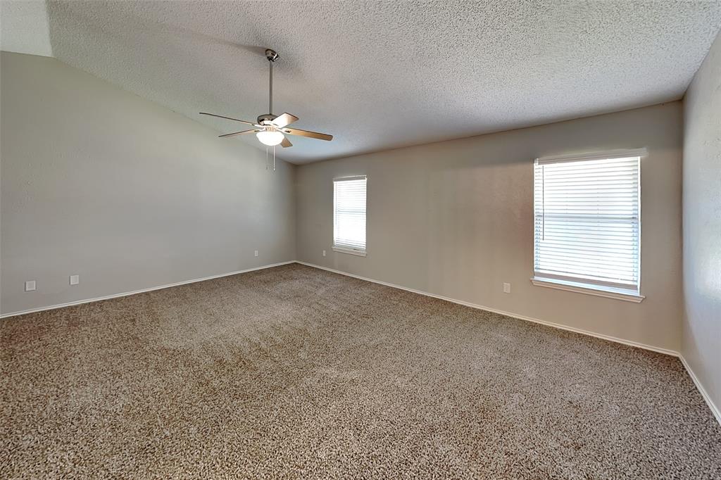 604 Ashby Place Allen, TX 75002 - Photo 10 of 21 an empty room with a window and a ceiling fan
