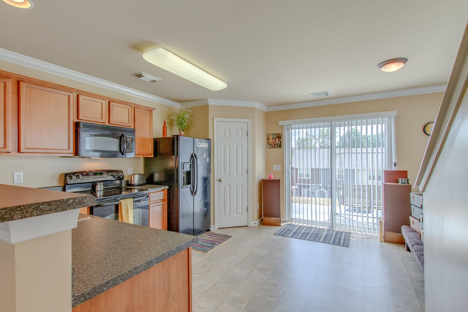 1382 Rural Hill Road, Unit 180 Antioch, TN 37013 - Photo 12 of 30 a kitchen with stainless steel appliances granite countertop a refrigerator stove and sink