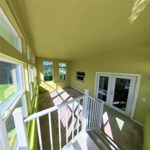 a view of a house with backyard and wooden floor