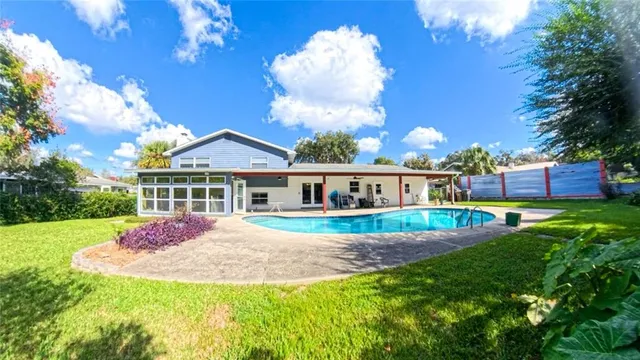 a front view of house with yard and green space