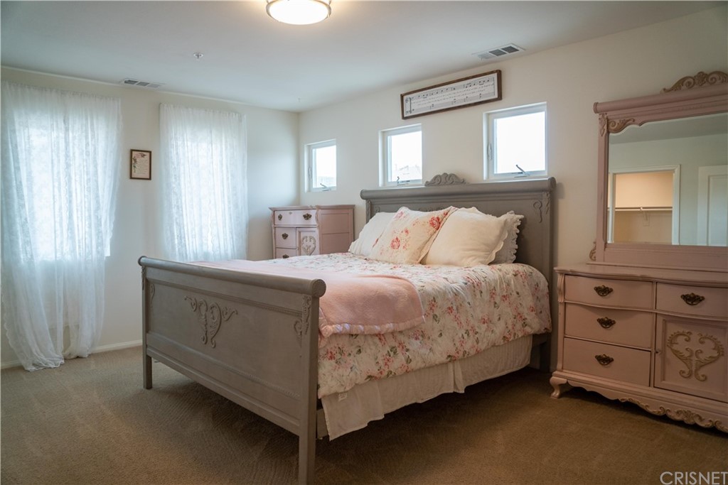 110 Main Street Piru, CA 93040 - Photo 7 of 13 a bedroom with a bed and a dresser