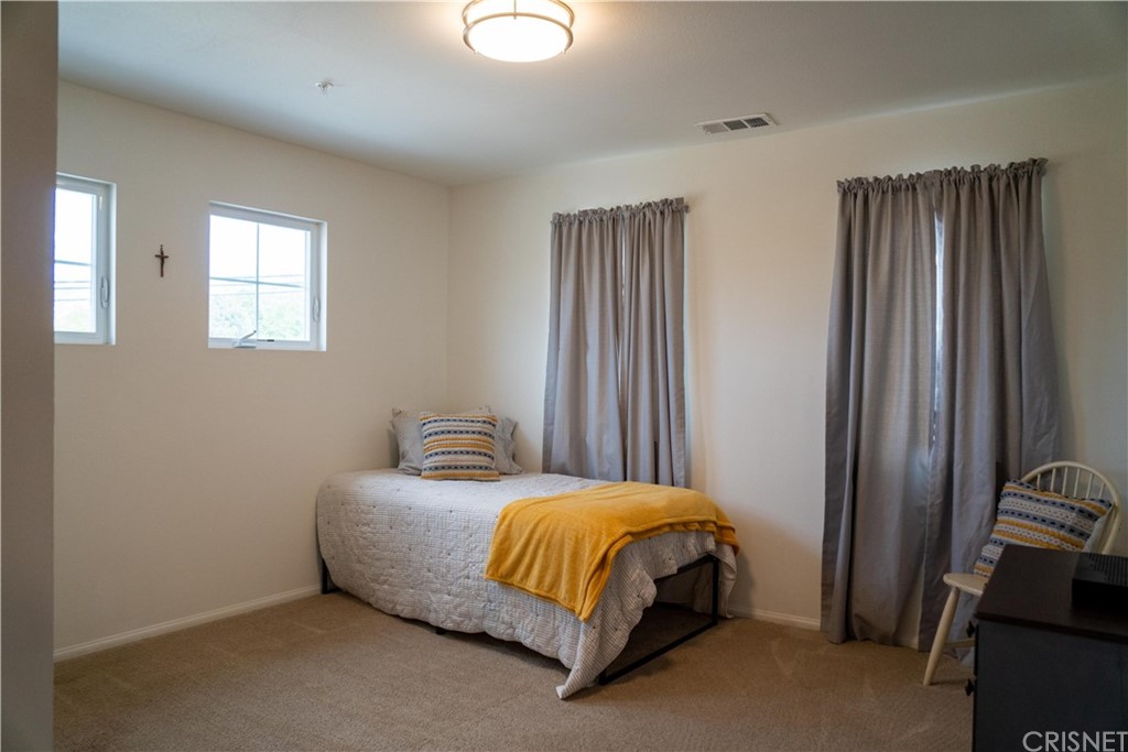 110 Main Street Piru, CA 93040 - Photo 10 of 13 a bedroom with a bed and a window