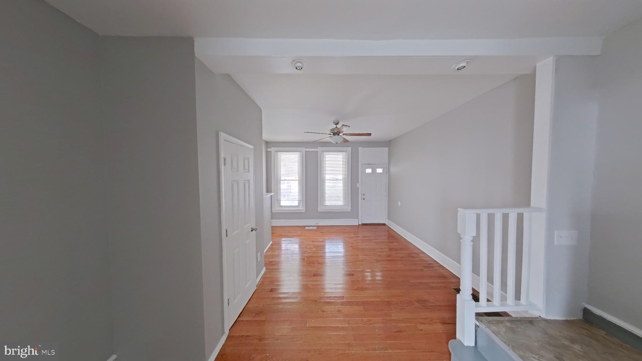 2255 North Cleveland Street Philadelphia, PA 19132 - Photo 2 of 9 a view of an empty room with wooden floor and a window