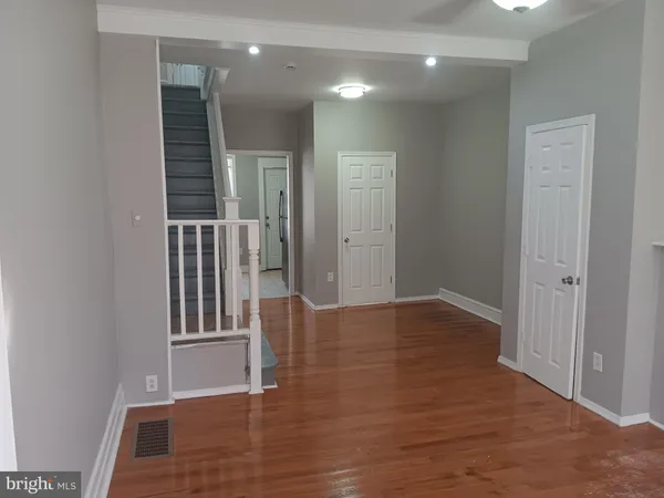 a view of entryway with wooden floor