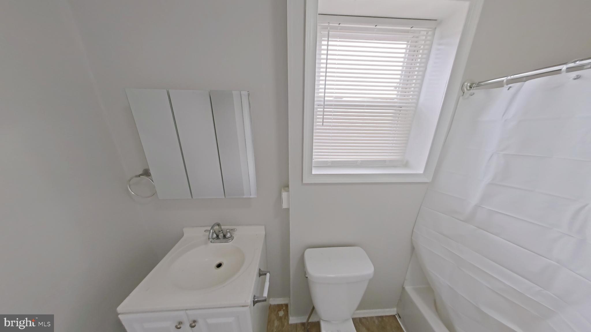 2255 North Cleveland Street Philadelphia, PA 19132 - Photo 6 of 9 a bathroom with a toilet and a bathtub