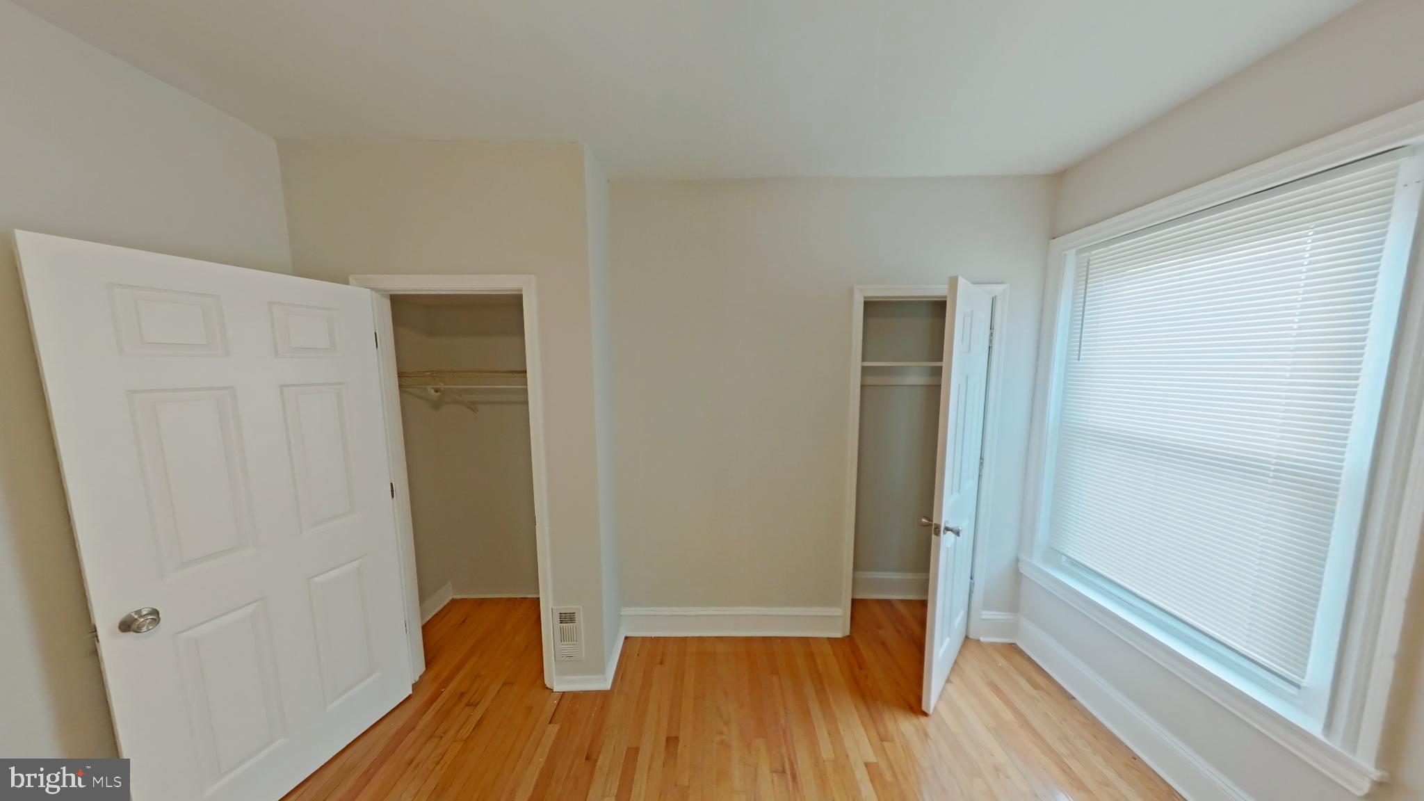 2255 North Cleveland Street Philadelphia, PA 19132 - Photo 8 of 9 a view of a hallway with wooden floor and closet