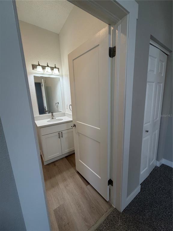 205 South 13th Street Palatka, FL 32177 - Photo 13 of 39 a bathroom with a sink a mirror and shower