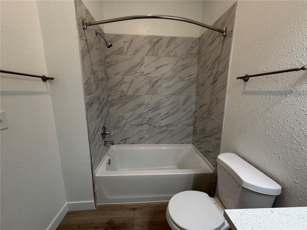 205 South 13th Street Palatka, FL 32177 - Photo 15 of 39 a bathroom with a toilet and a bathtub