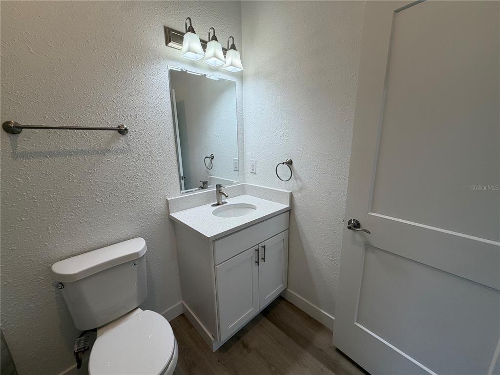 205 South 13th Street Palatka, FL 32177 - Photo 16 of 39 a bathroom with a toilet sink and mirror