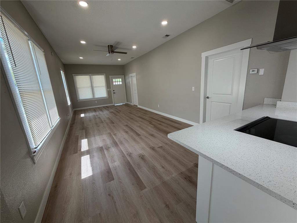 205 South 13th Street Palatka, FL 32177 - Photo 21 of 39 a kitchen with wooden floor and window