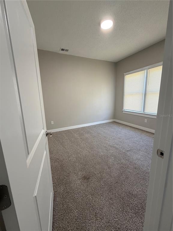 205 South 13th Street Palatka, FL 32177 - Photo 25 of 39 an empty room with windows