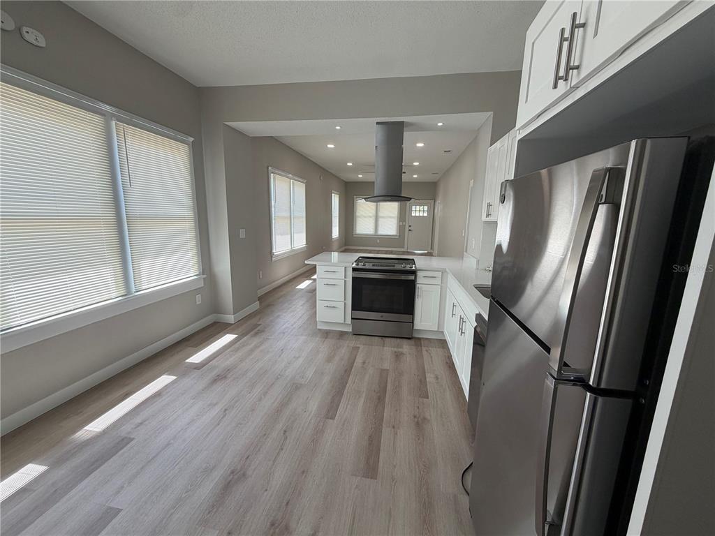 205 South 13th Street Palatka, FL 32177 - Photo 27 of 39 a view of a kitchen with a sink stove refrigerator and a window