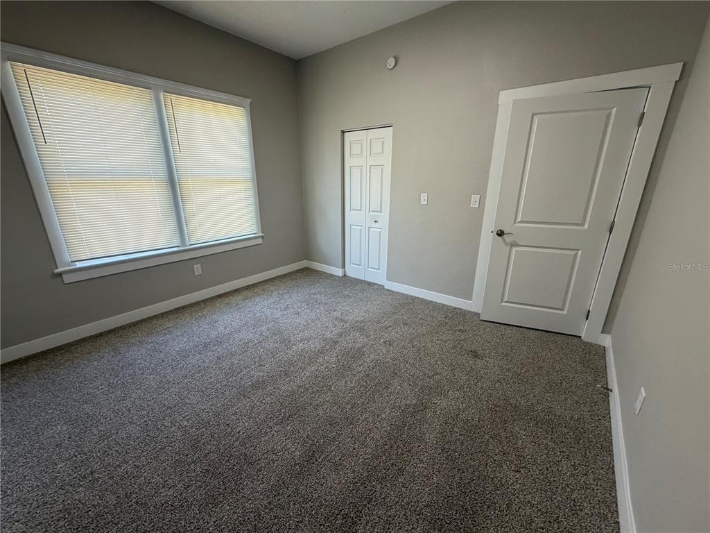 205 South 13th Street Palatka, FL 32177 - Photo 28 of 39 an empty room with windows and closet