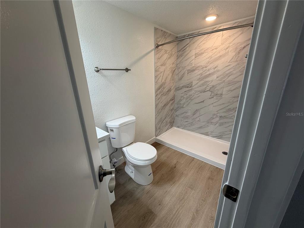 205 South 13th Street Palatka, FL 32177 - Photo 33 of 39 a bathroom with a toilet and a shower