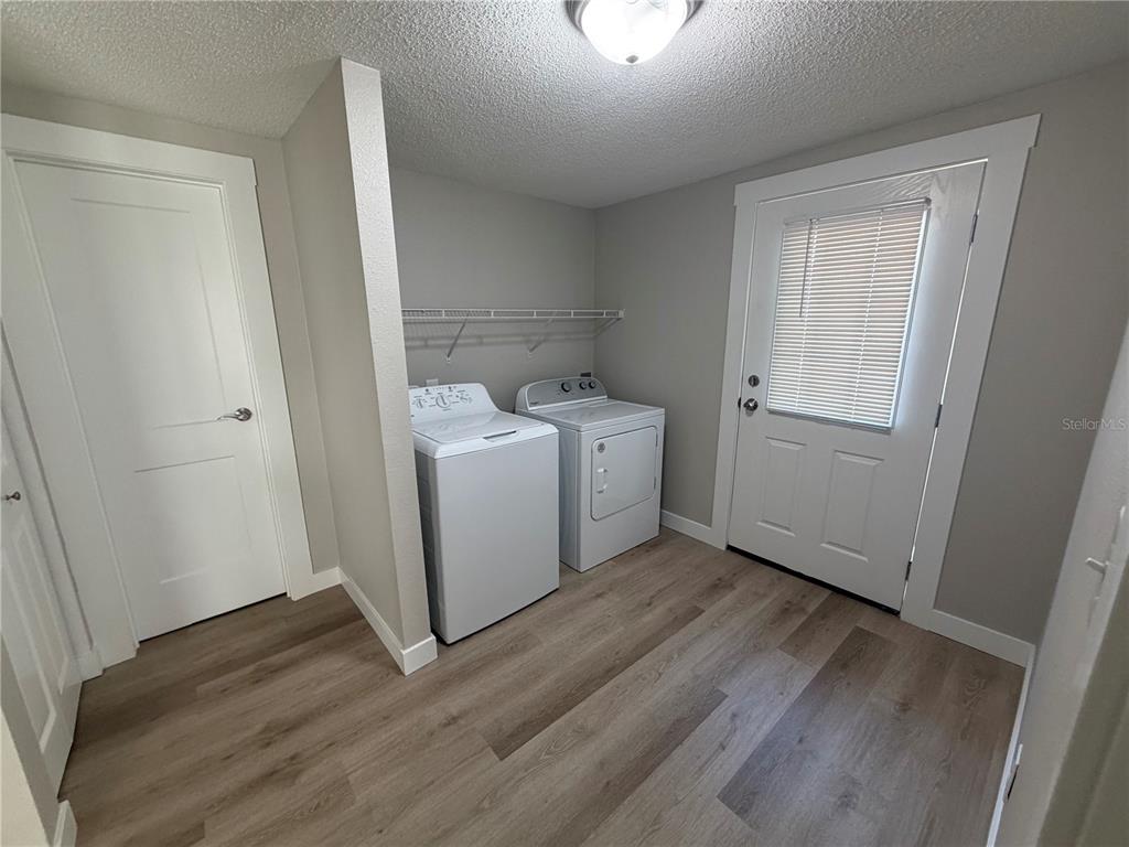 205 South 13th Street Palatka, FL 32177 - Photo 37 of 39 a utility room with wooden floor washer and dryer