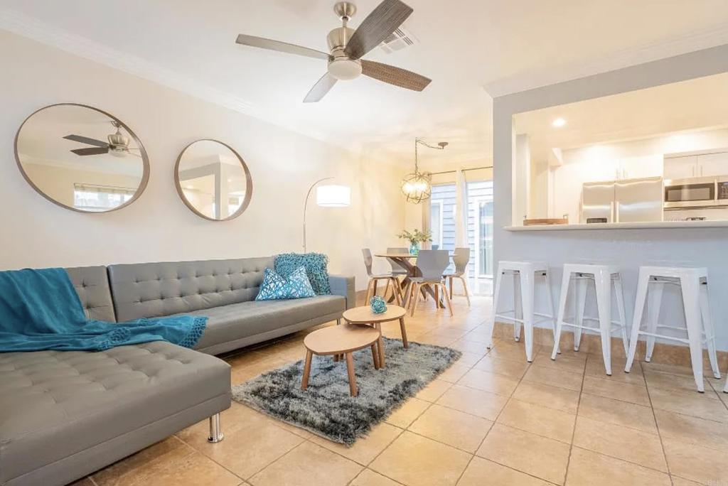 1330 Reed Avenue, Unit 2 San Diego, CA 92109 - Photo 1 of 1 a living room with furniture a rug and a large window