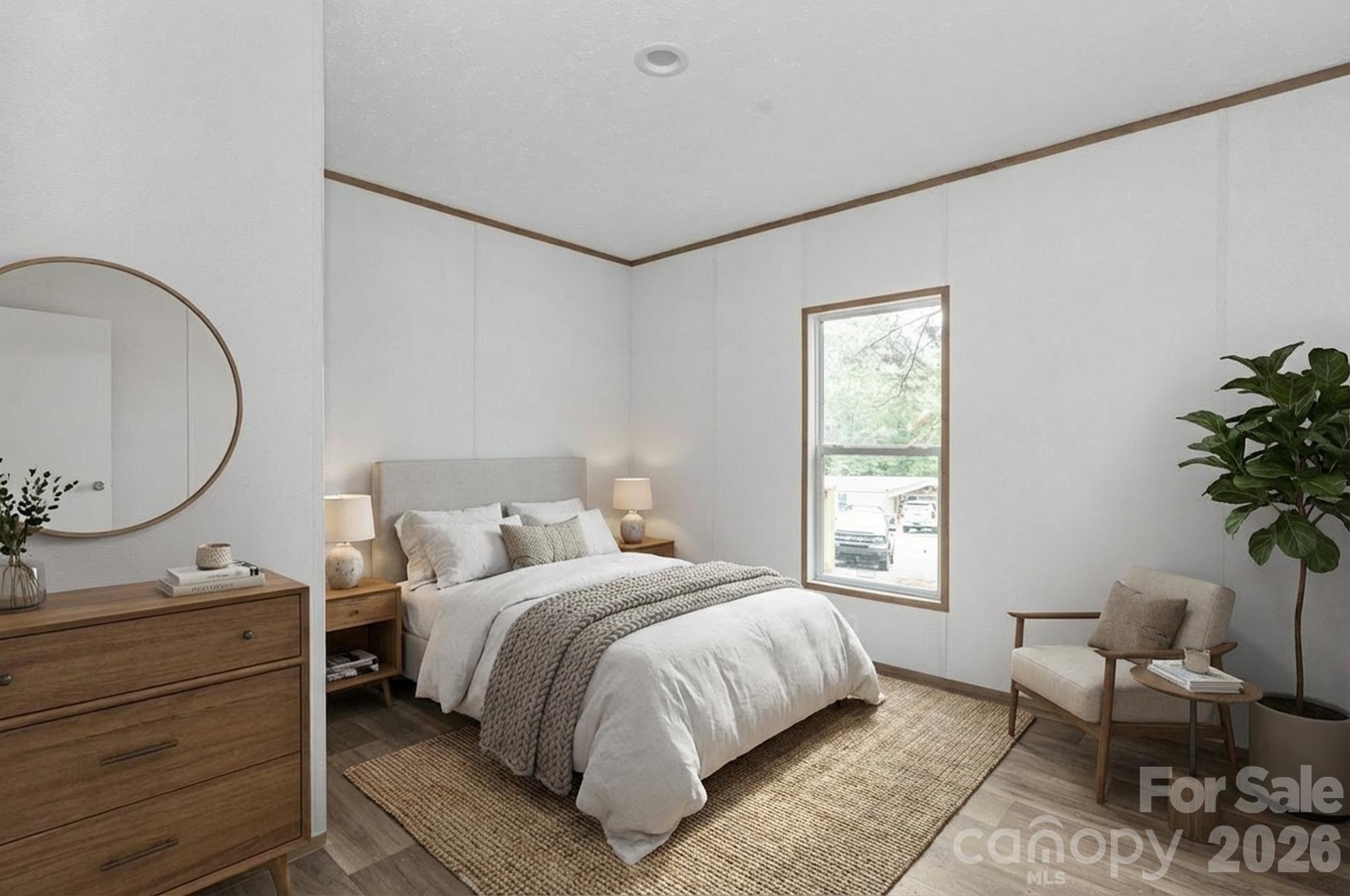 536 Lincolnview Road Lincolnton, NC 28092 - Photo 14 of 32 a bed room with a bed and a potted plant