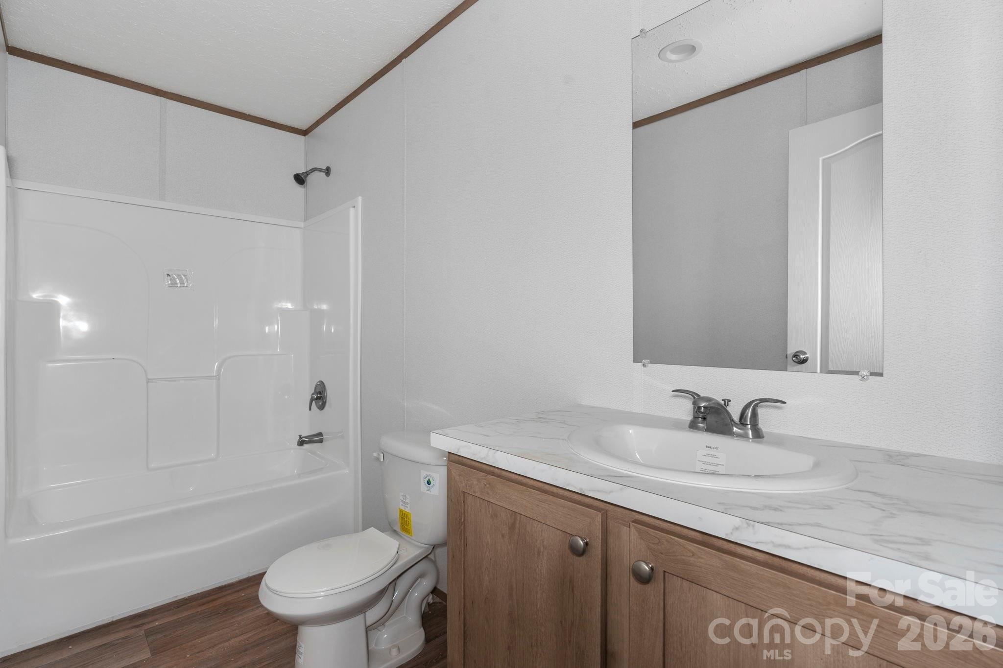 536 Lincolnview Road Lincolnton, NC 28092 - Photo 15 of 32 a bathroom with a granite countertop sink a toilet and shower
