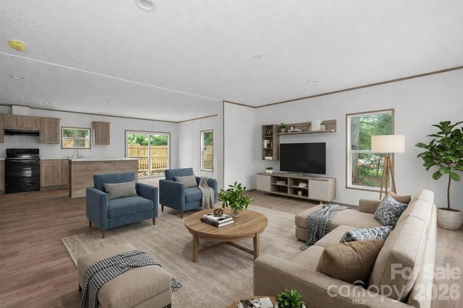 536 Lincolnview Road Lincolnton, NC 28092 - Photo 3 of 32 a living room with furniture and a flat screen tv
