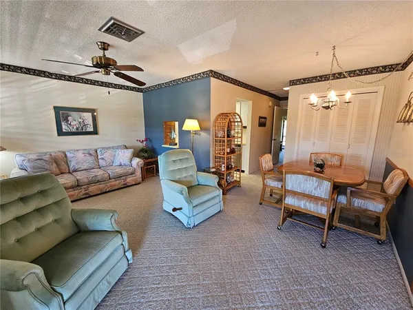 a bedroom with furniture and a chandelier