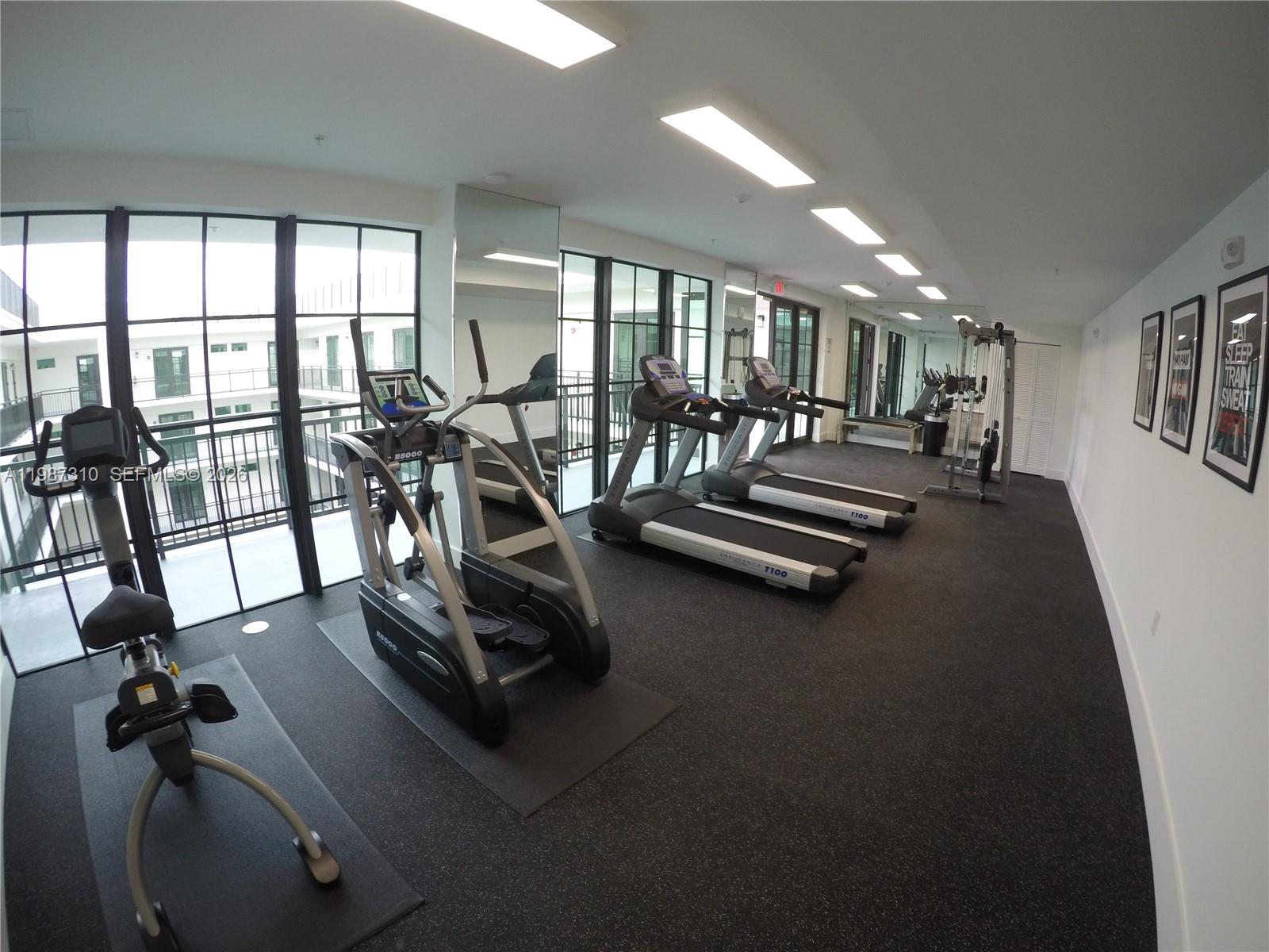 4100 Southwest 64th Avenue, Unit 409 Davie, FL 33314 - Photo 12 of 19 a view of a room with gym equipment