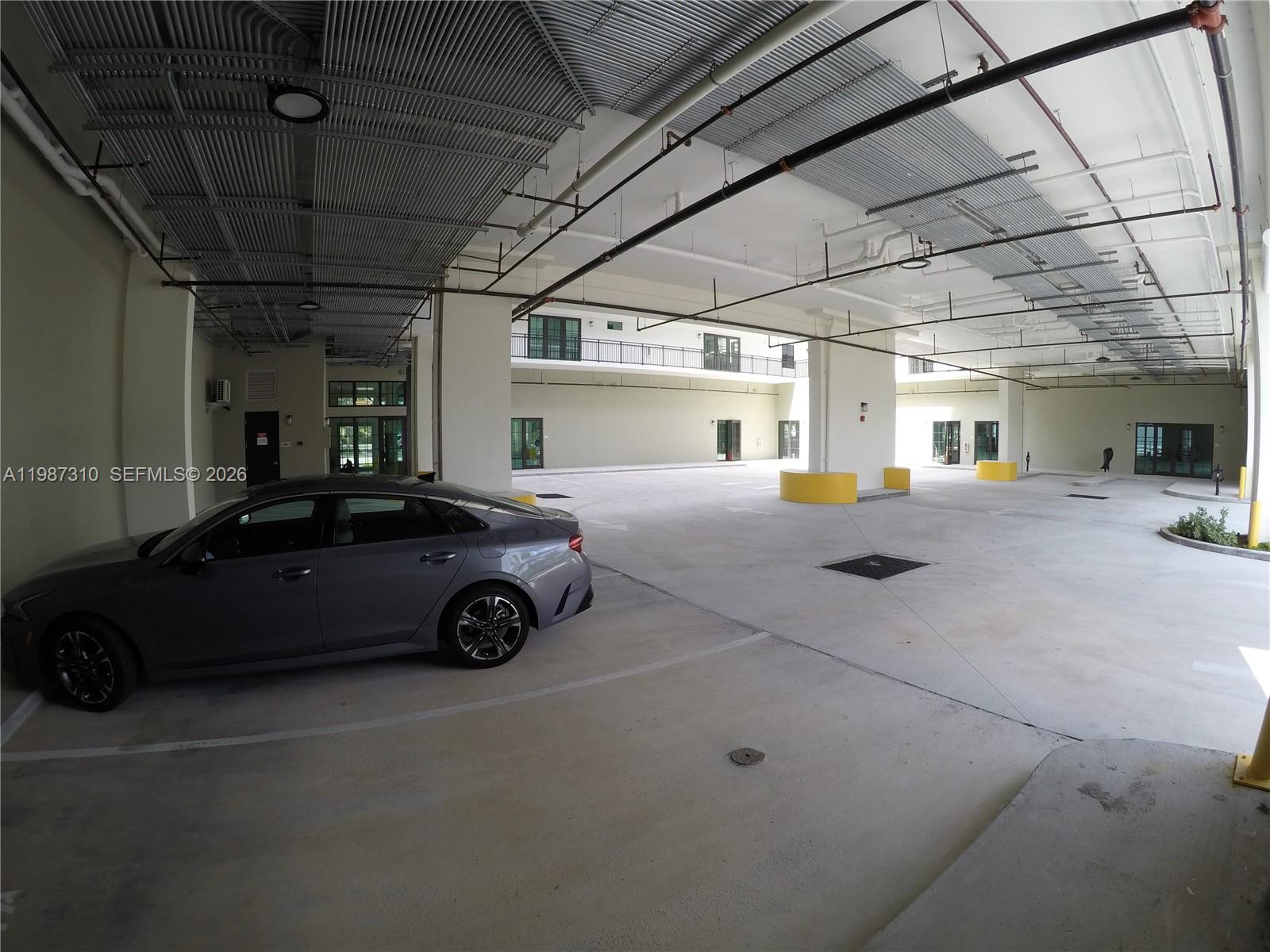 4100 Southwest 64th Avenue, Unit 409 Davie, FL 33314 - Photo 18 of 19 a car parked in parking garage