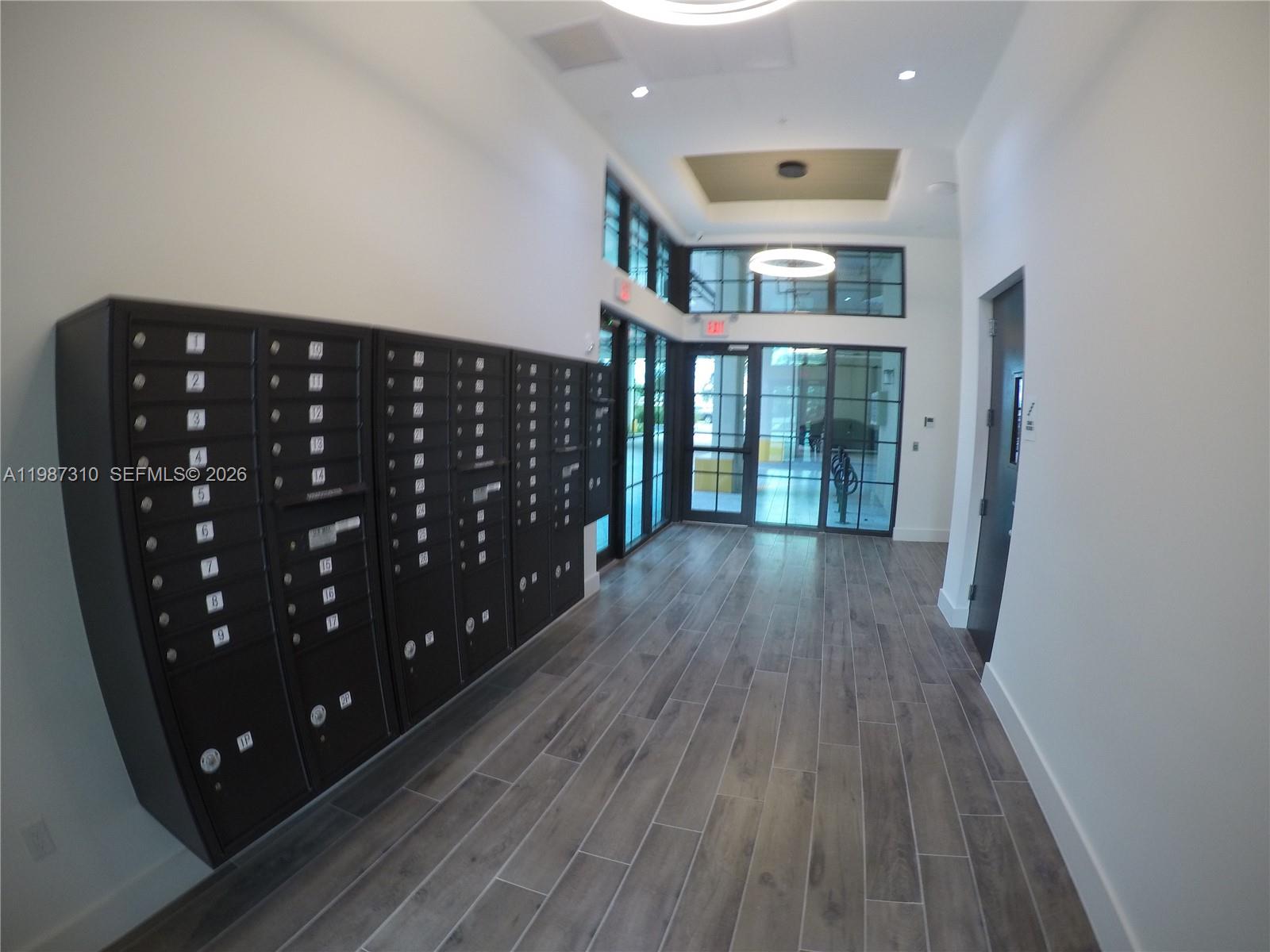 4100 Southwest 64th Avenue, Unit 409 Davie, FL 33314 - Photo 2 of 19 a view of a hallway with wooden floor