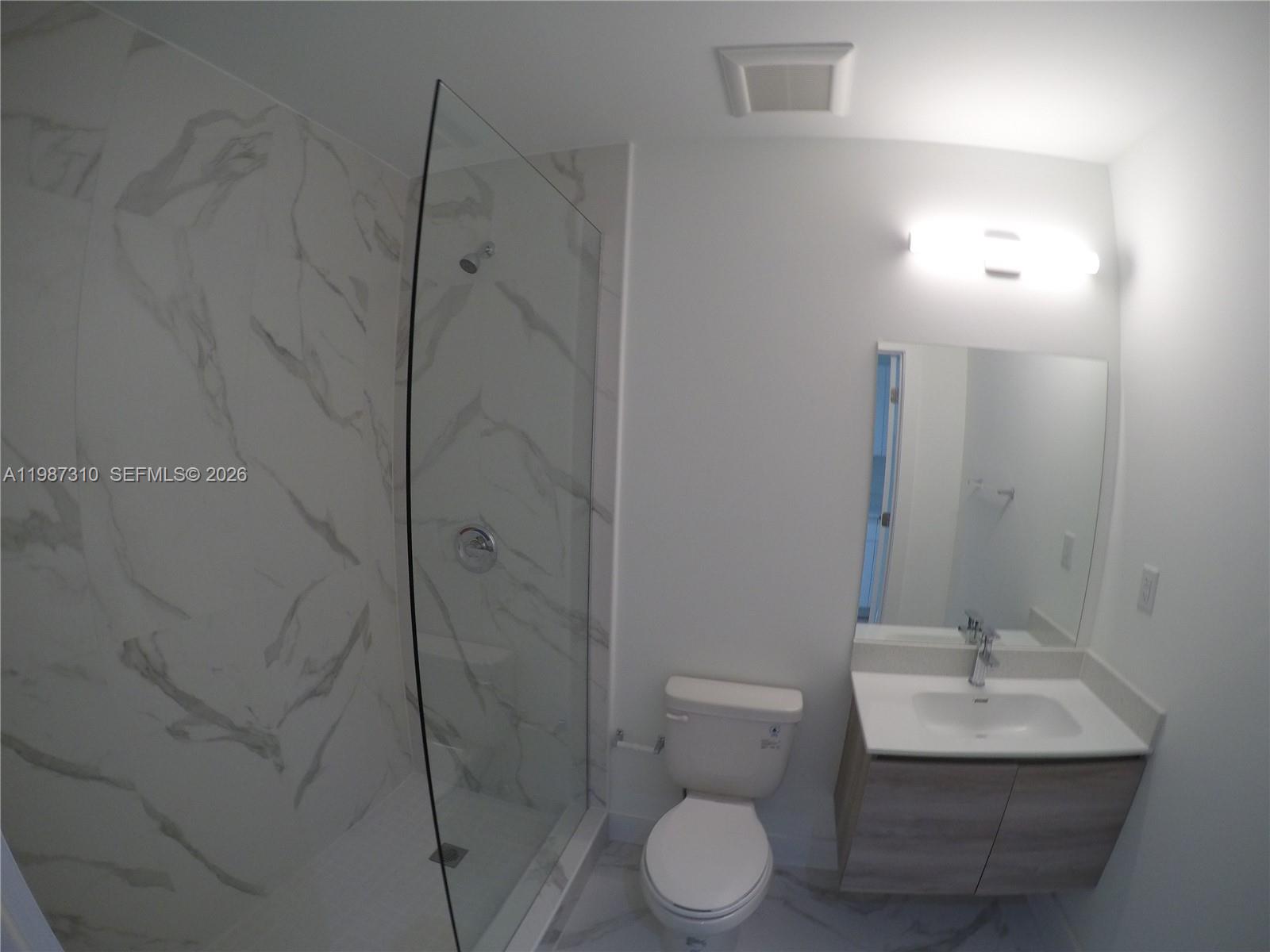 4100 Southwest 64th Avenue, Unit 409 Davie, FL 33314 - Photo 7 of 19 a bathroom with a sink toilet and shower