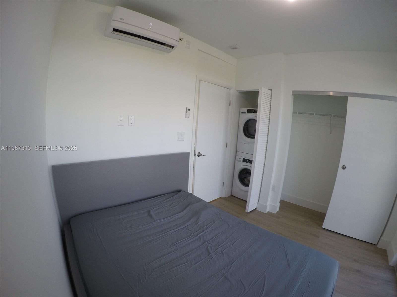 4100 Southwest 64th Avenue, Unit 409 Davie, FL 33314 - Photo 8 of 19 an empty room with closet and mirror