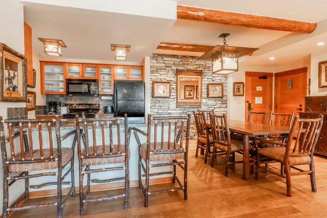 a dining area with furniture and outdoor view