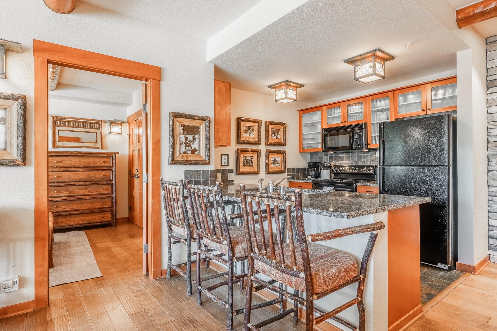 6201 Minaret Road, Unit 2317 Mammoth Lakes, CA 93546 - Photo 12 of 44 a view of a livingroom with furniture a flat screen tv and staircase