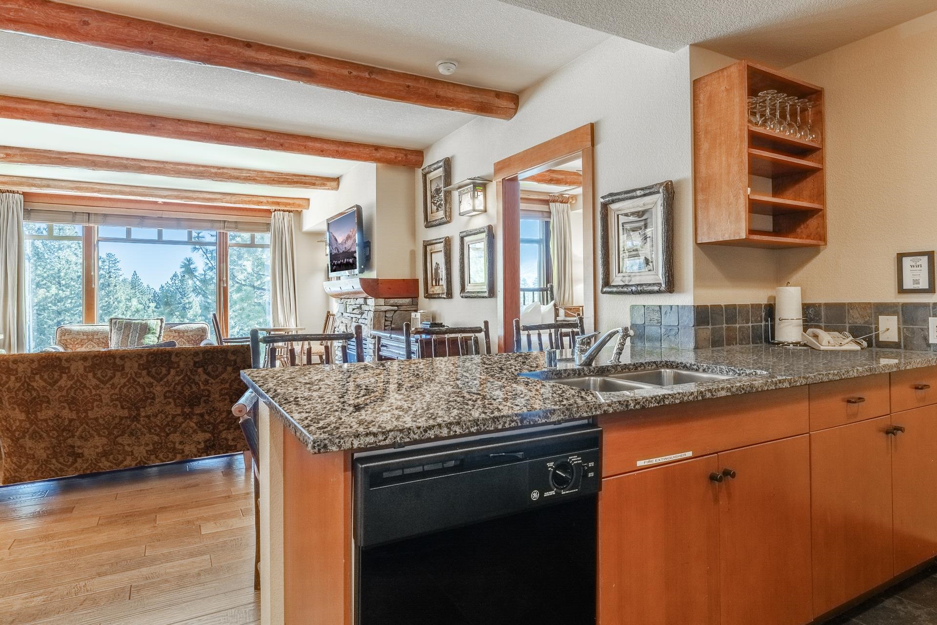 6201 Minaret Road, Unit 2317 Mammoth Lakes, CA 93546 - Photo 17 of 44 a kitchen with stainless steel appliances granite countertop a sink and a counter space