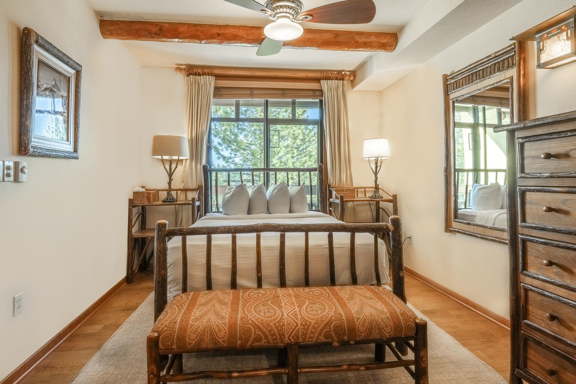 6201 Minaret Road, Unit 2317 Mammoth Lakes, CA 93546 - Photo 19 of 44 a bedroom with a bed and wooden floor