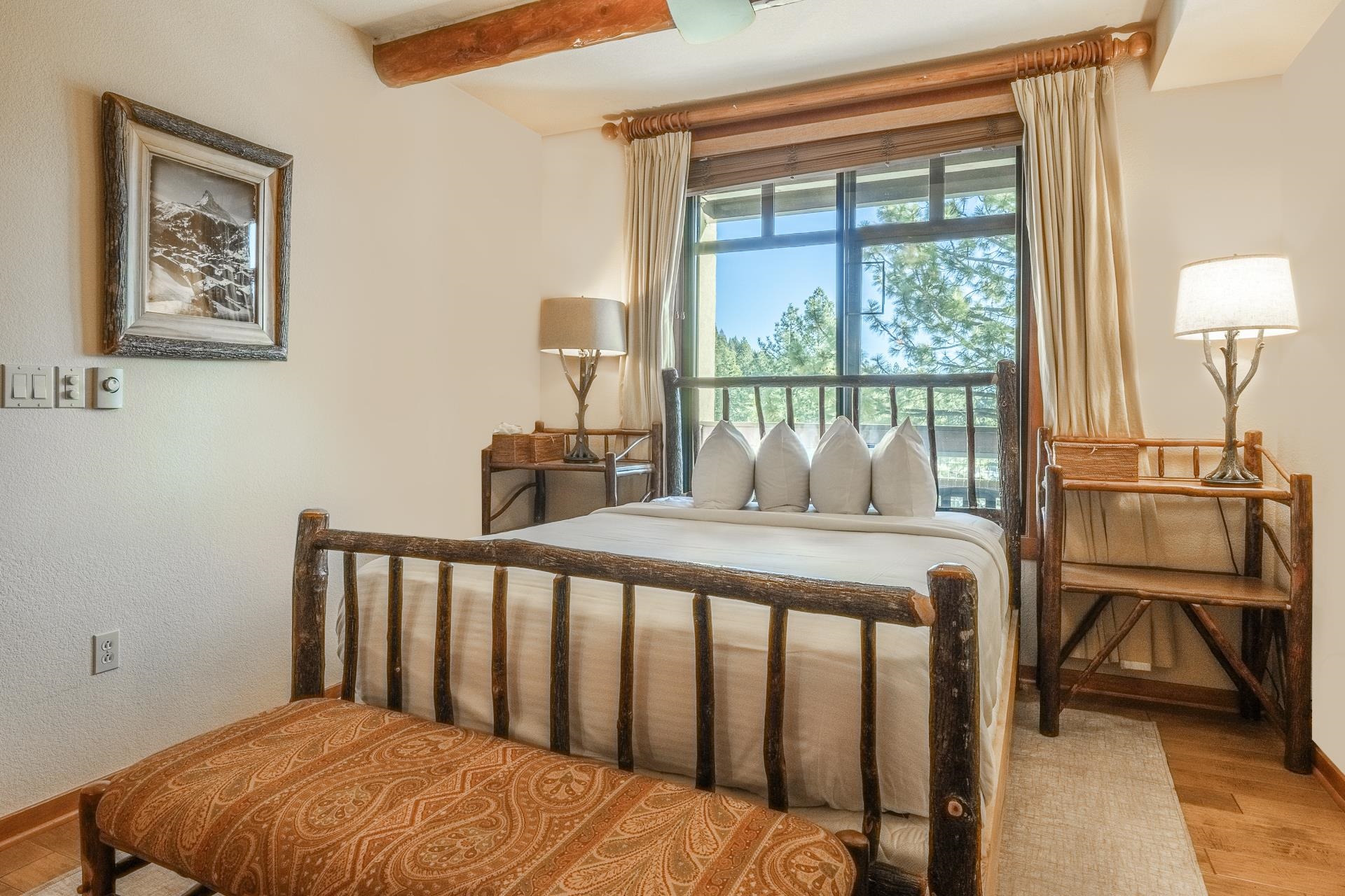 6201 Minaret Road, Unit 2317 Mammoth Lakes, CA 93546 - Photo 20 of 44 a bedroom with a bed and wooden floor