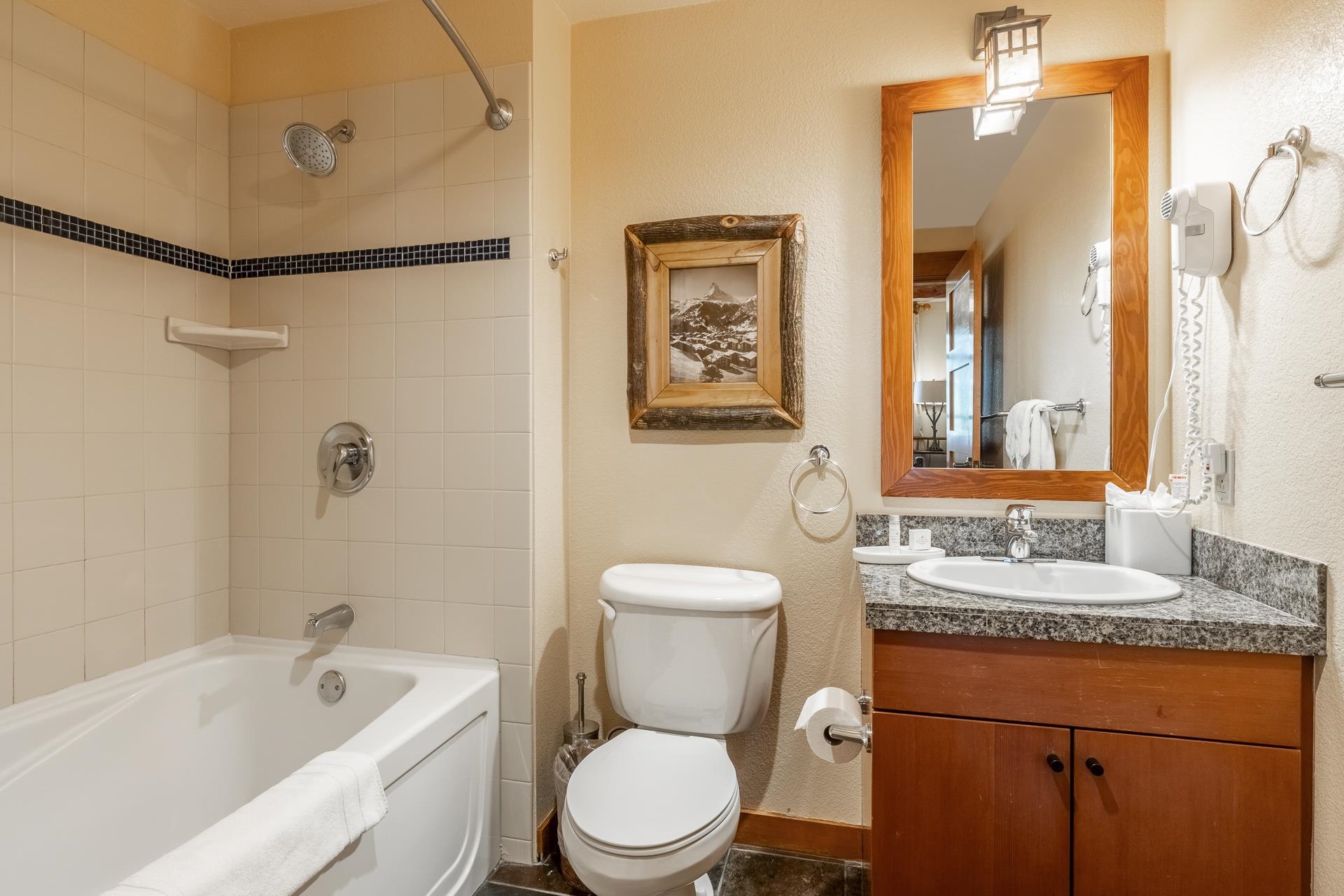 6201 Minaret Road, Unit 2317 Mammoth Lakes, CA 93546 - Photo 24 of 44 a bathroom with a toilet sink and mirror