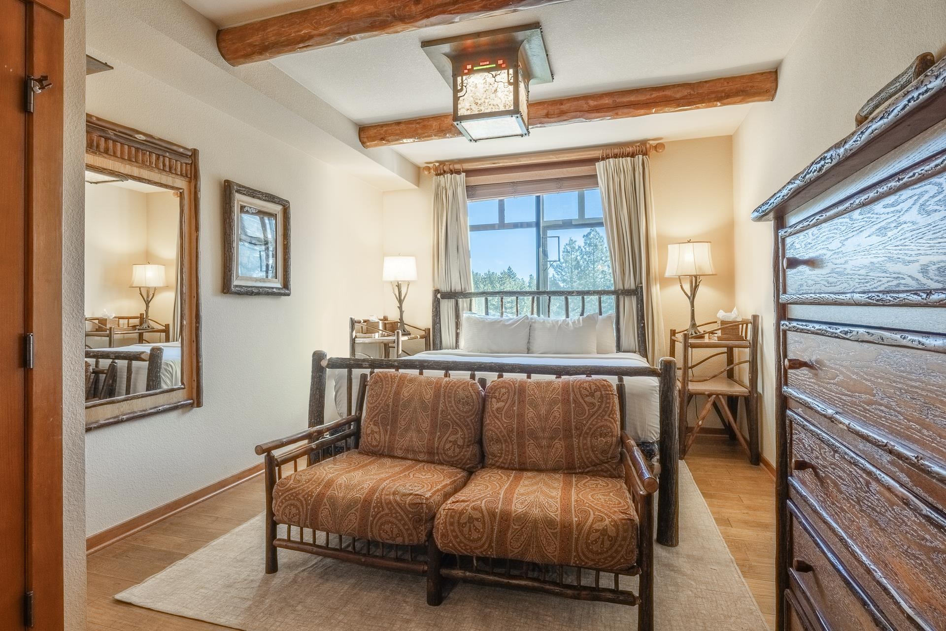 6201 Minaret Road, Unit 2317 Mammoth Lakes, CA 93546 - Photo 30 of 44 a bedroom with furniture and a window