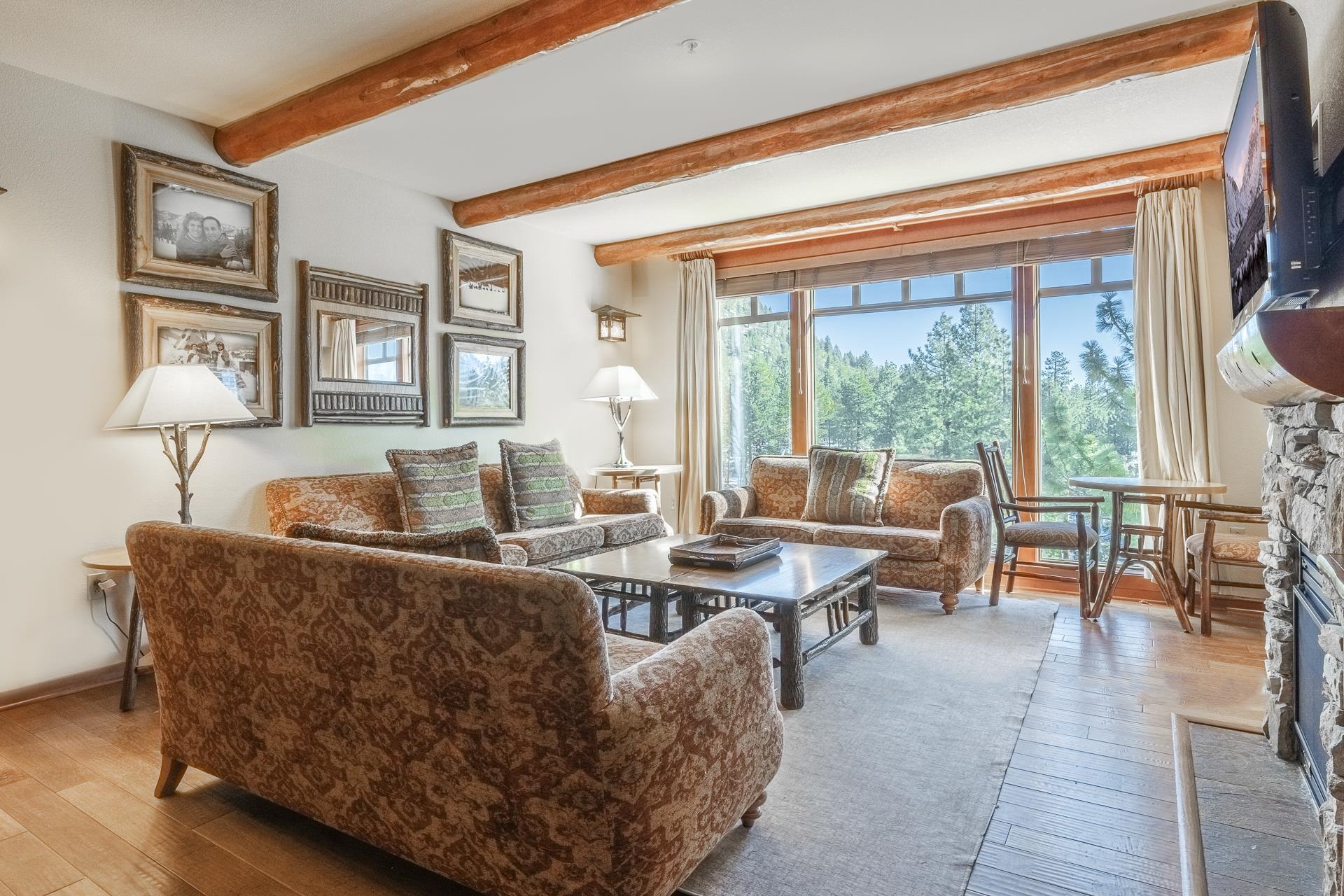 6201 Minaret Road, Unit 2317 Mammoth Lakes, CA 93546 - Photo 3 of 44 a living room with furniture and a window